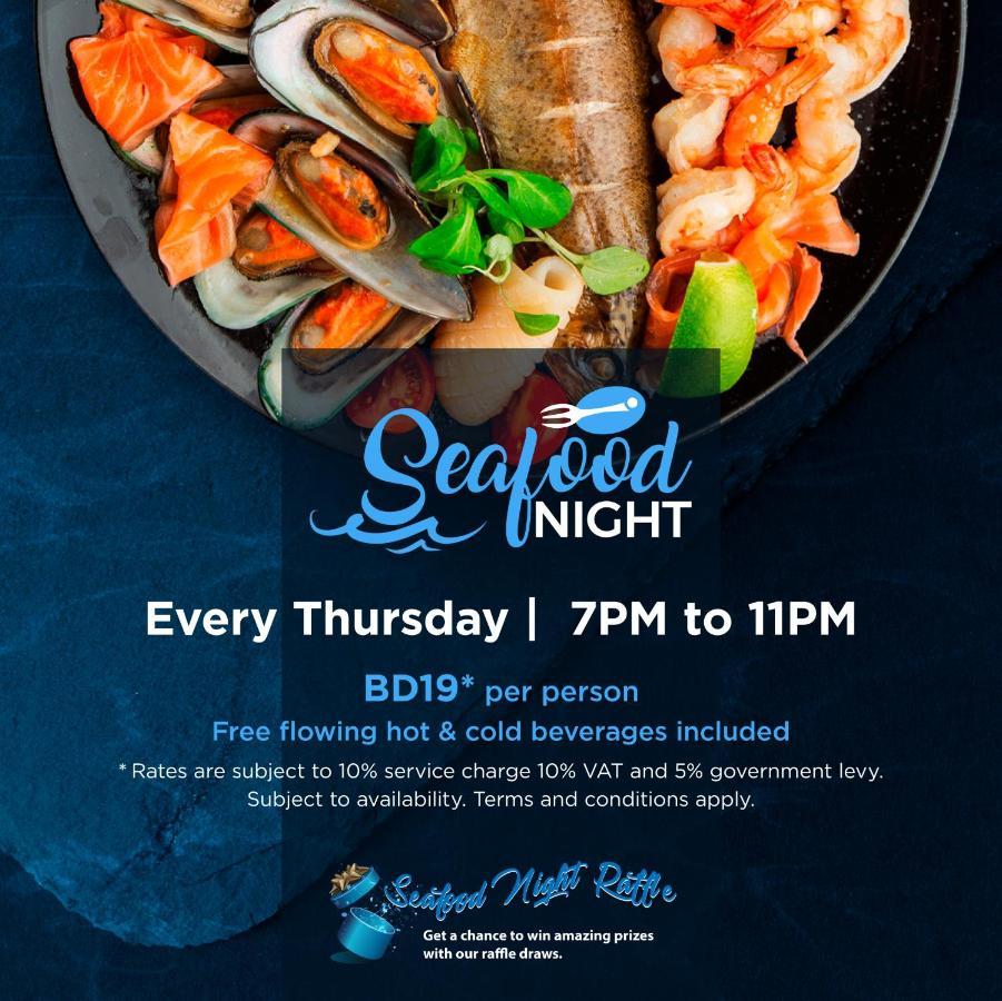 Wyndham Grand Manama Hotel Exterior photo The image promotes a "Seafood Night" event that takes place every Thursday from 7 PM to 11 PM. It features a plate of various seafood items, including shellfish and shrimp. The cost is listed as BD 19 per person, and the offer includes free-flowing h